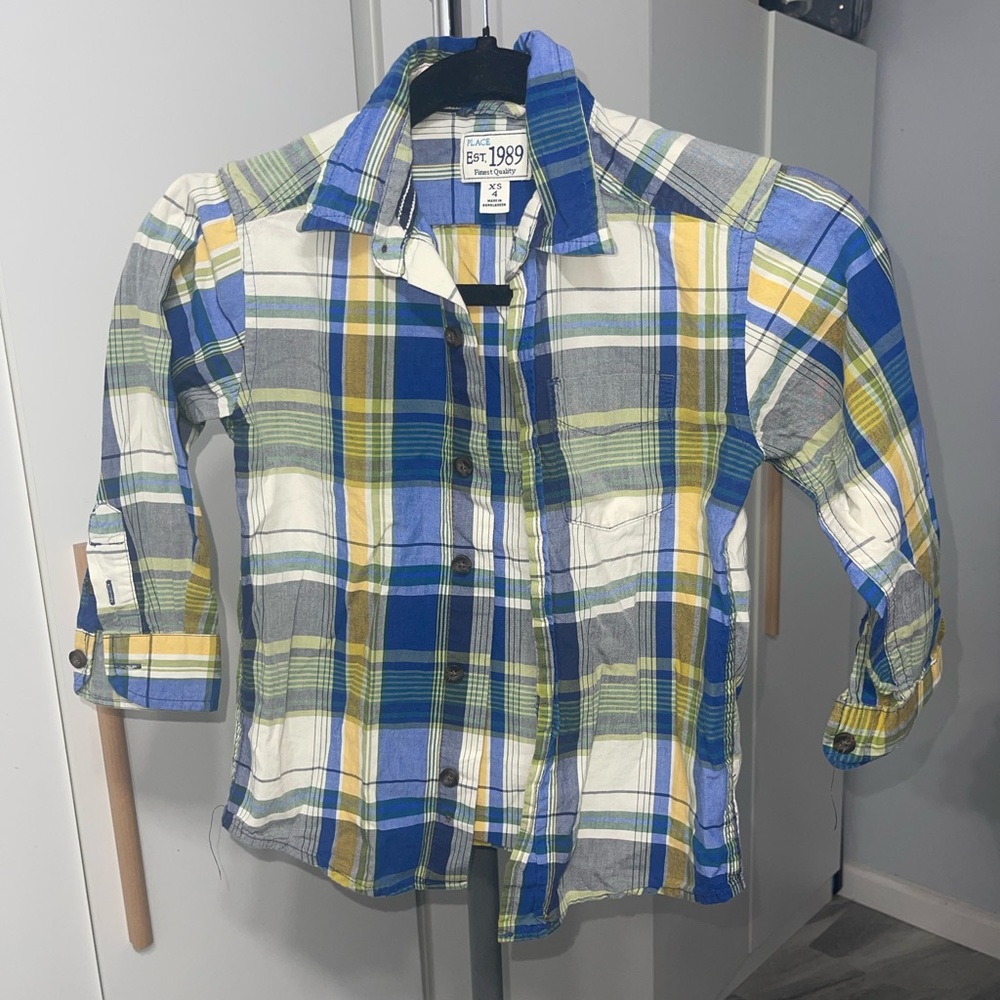 This cute button up shirt for little boys is so cute.